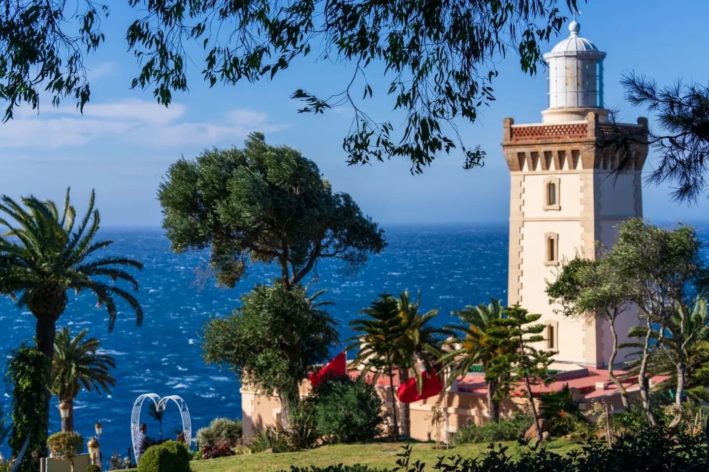 Minaret Beyond the Trees. The minaret appears as a vertical sign between trees and sky.