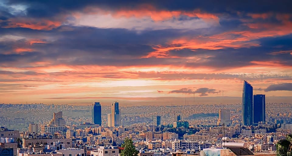 Ember Skyline. The skyline glows in ember tones before fading into darkness.