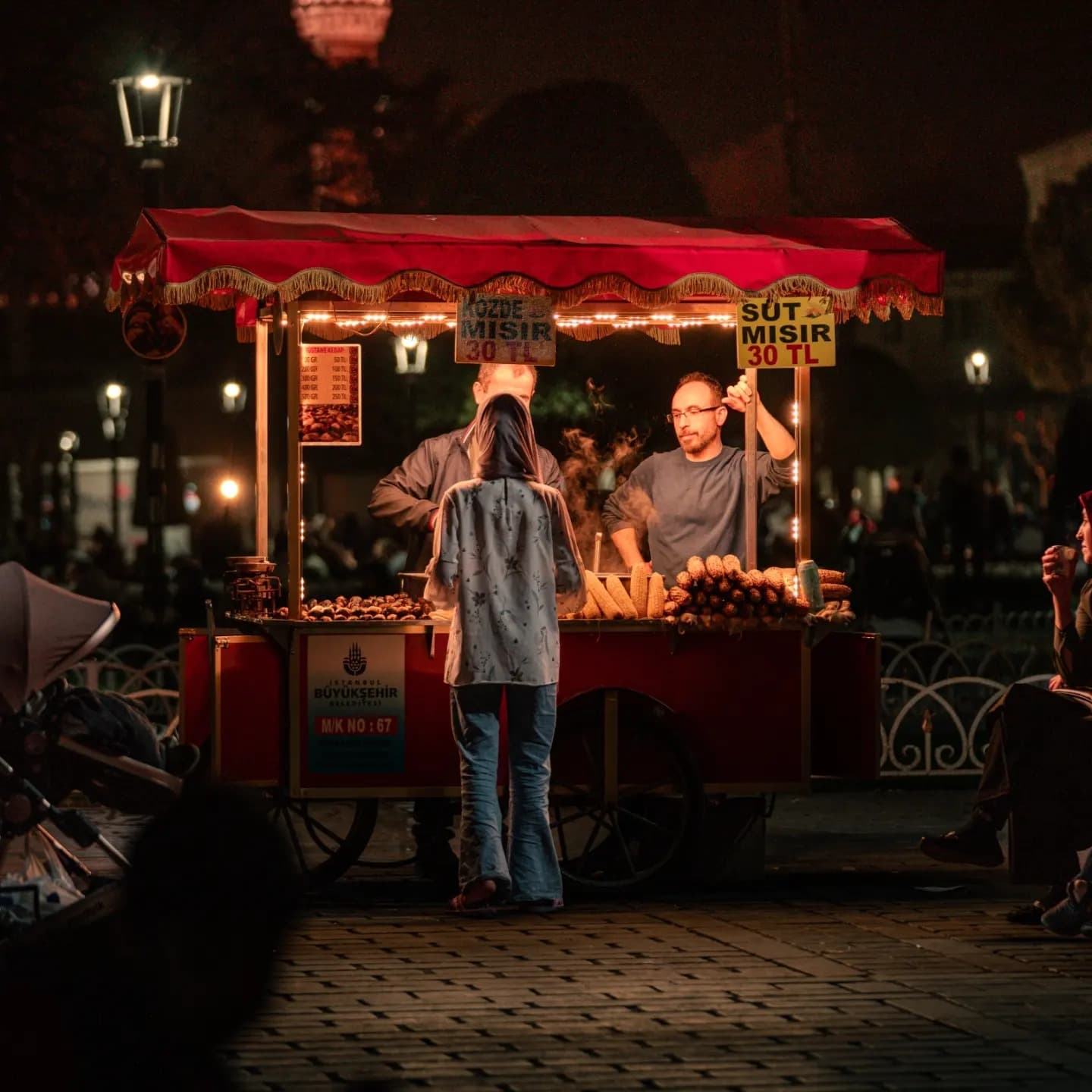 Night Vendor. A simple human moment glowing within the market at night.