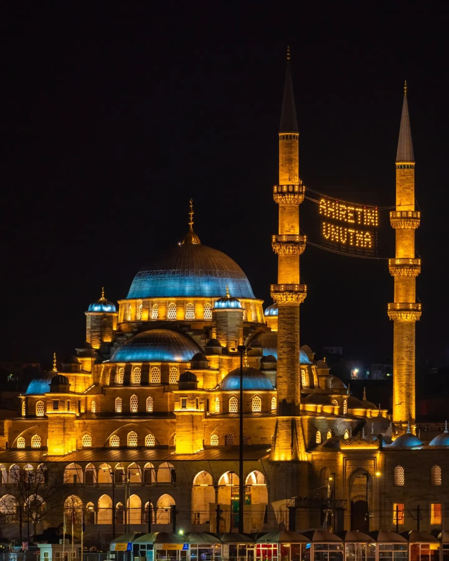 Blue Mosque at Night. The building shines as a lit volume against a clear night.