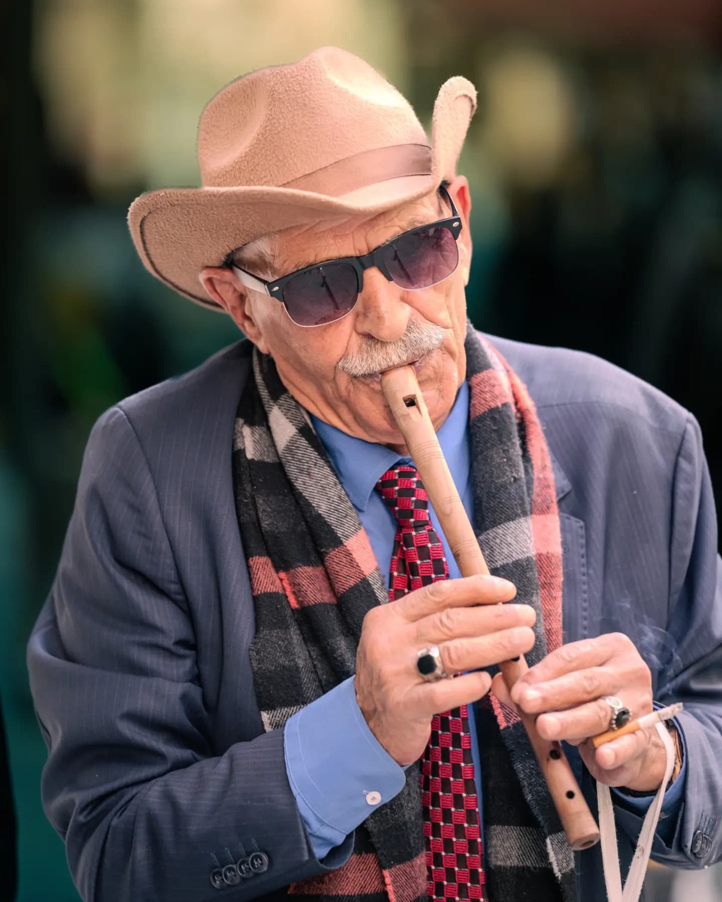 Street Musician. The musician creates a living center within the city's darkness.