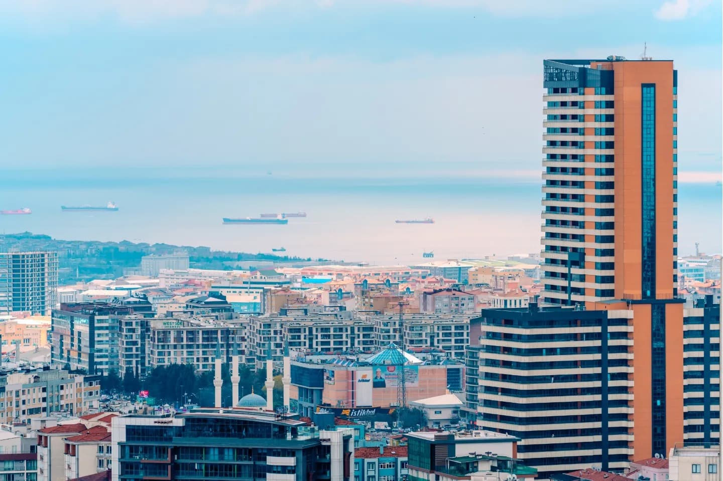 Harbour Tower. A white tower drawing a clear vertical line above the sea.