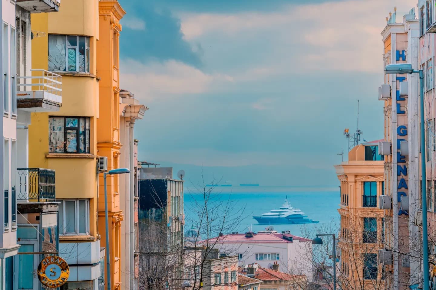 View Toward the Sea. The scene opens gradually from elevation toward distant blue.