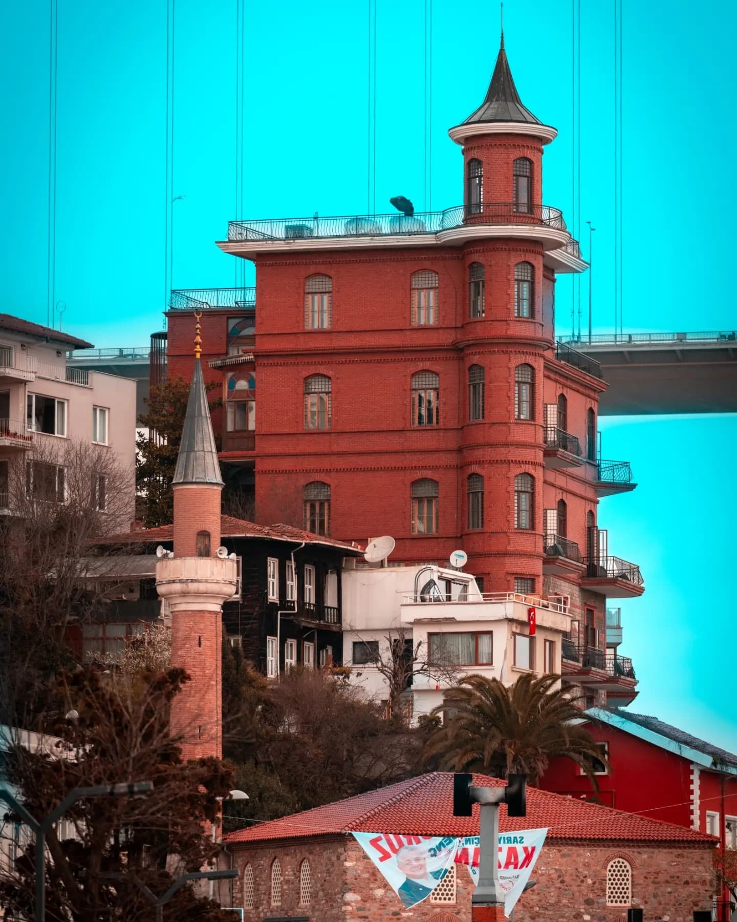 Cyan & Brick Facade. Cool and warm tones intersect across a single facade.