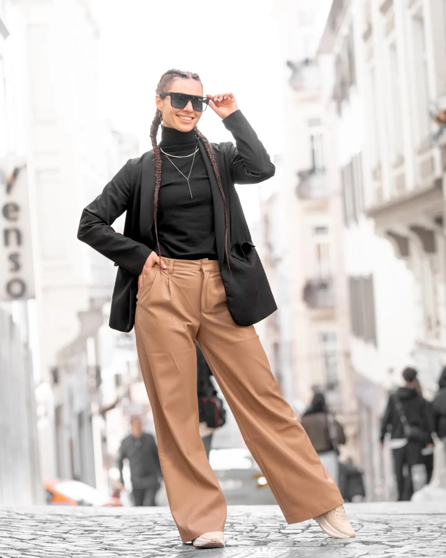 Street Silhouette. A light human silhouette moves through the street's depth and signs.