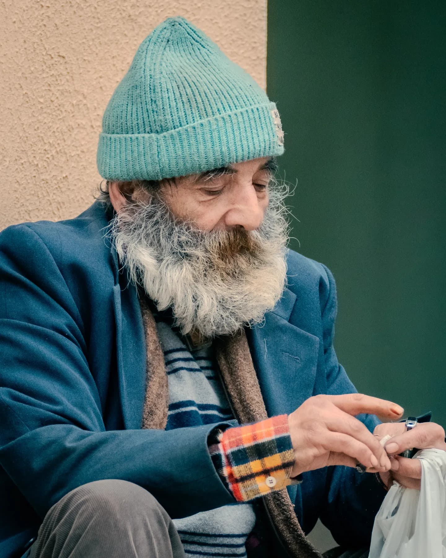 Hands of the Beanie Man. The hands complete the presence of the face and ground the portrait.