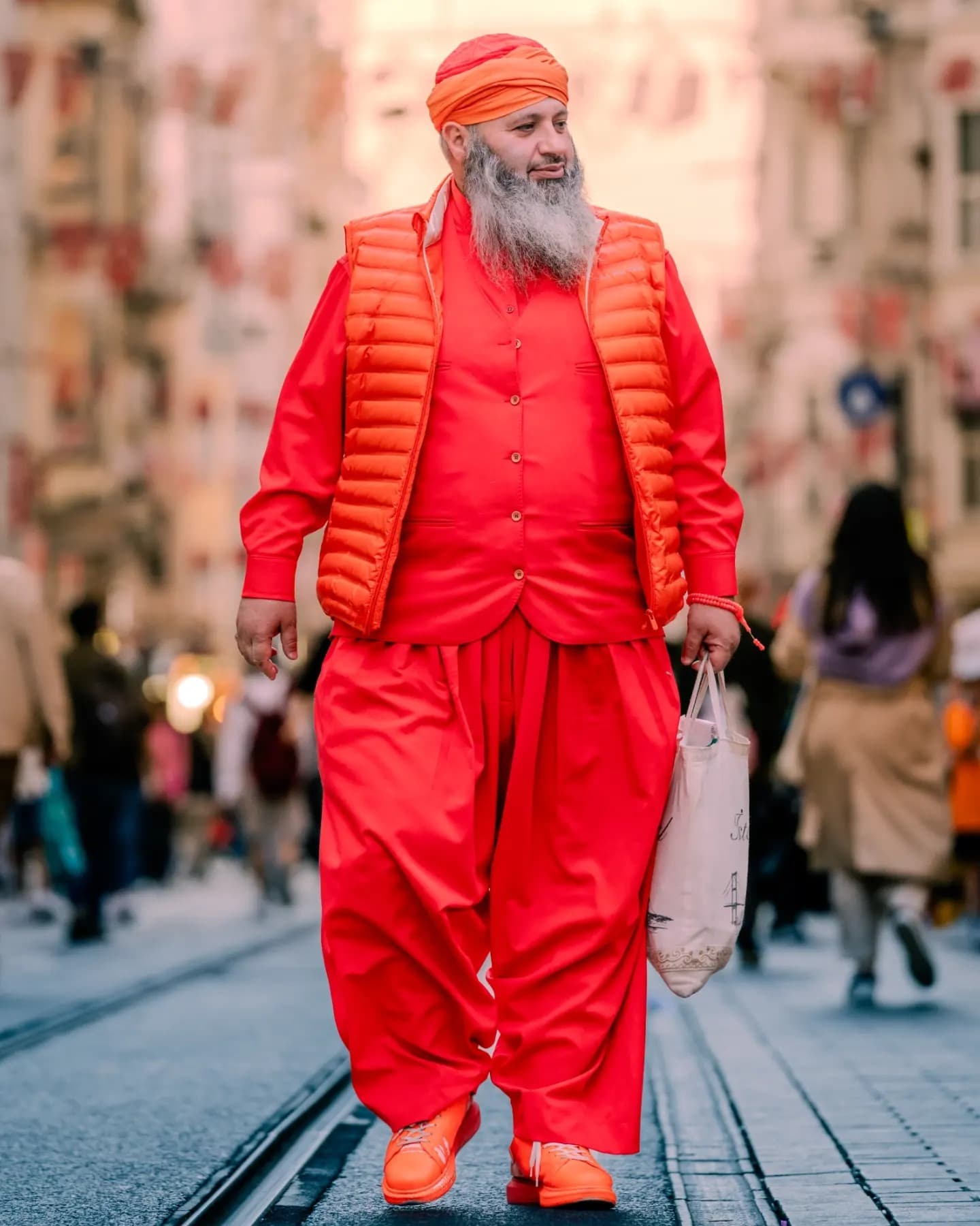 The Red Walker. The red coat catches movement before it disappears into depth.