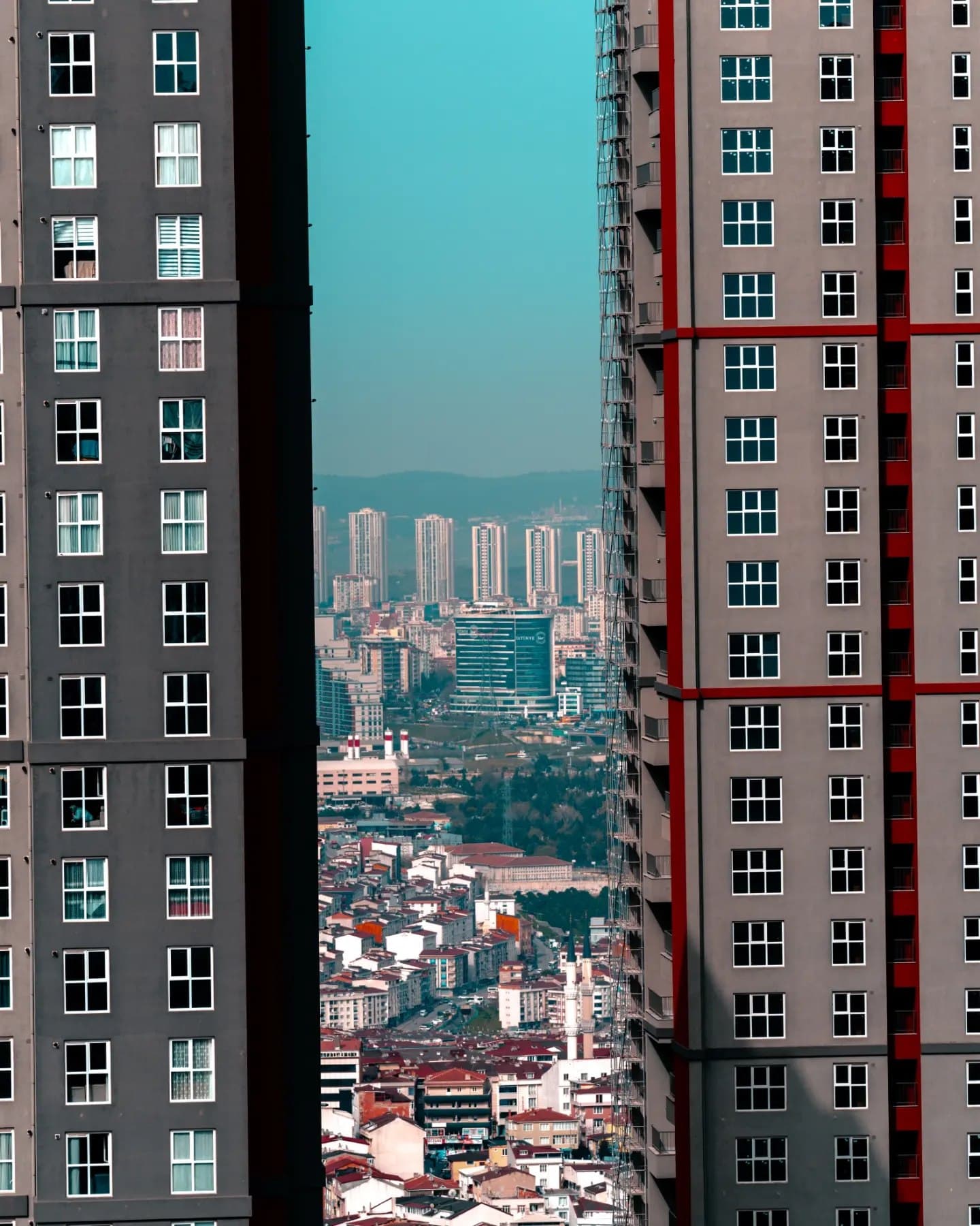 City Between Towers. An axial view compressing the city between two vertical masses.