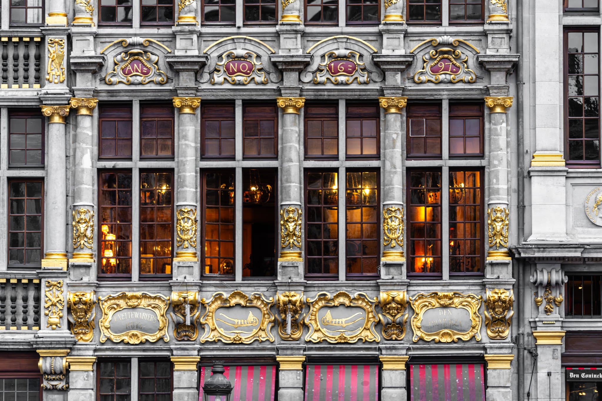 Gilded Windows. The facade detail balances ornament with stone discipline.