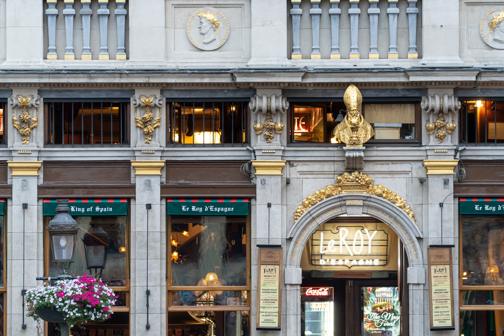 Shopfront in Stone. Commercial signage merges with the architecture without overpowering it.