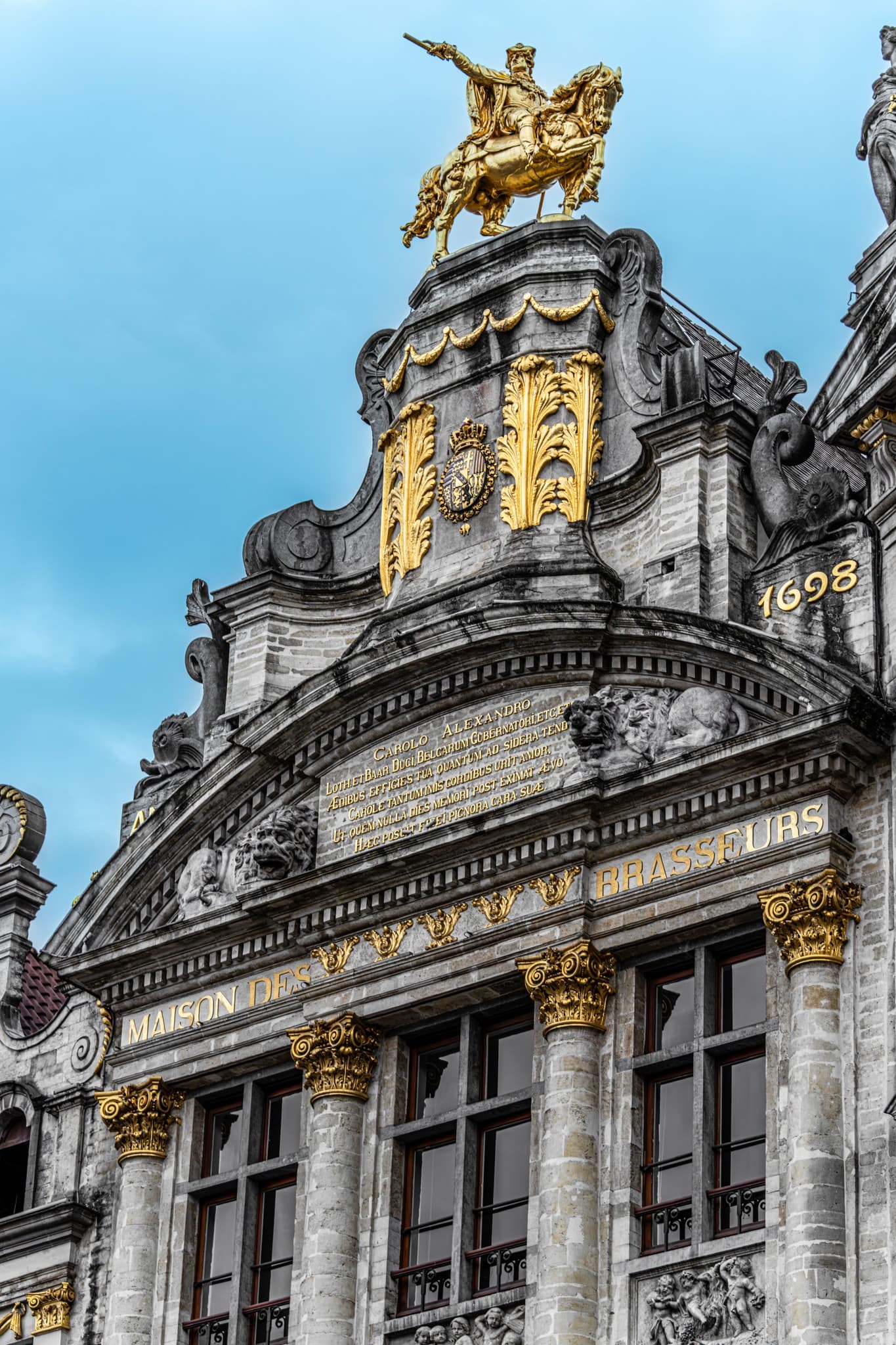 Golden Crest. A small detail condensing the building's grandeur into a vertical frame.