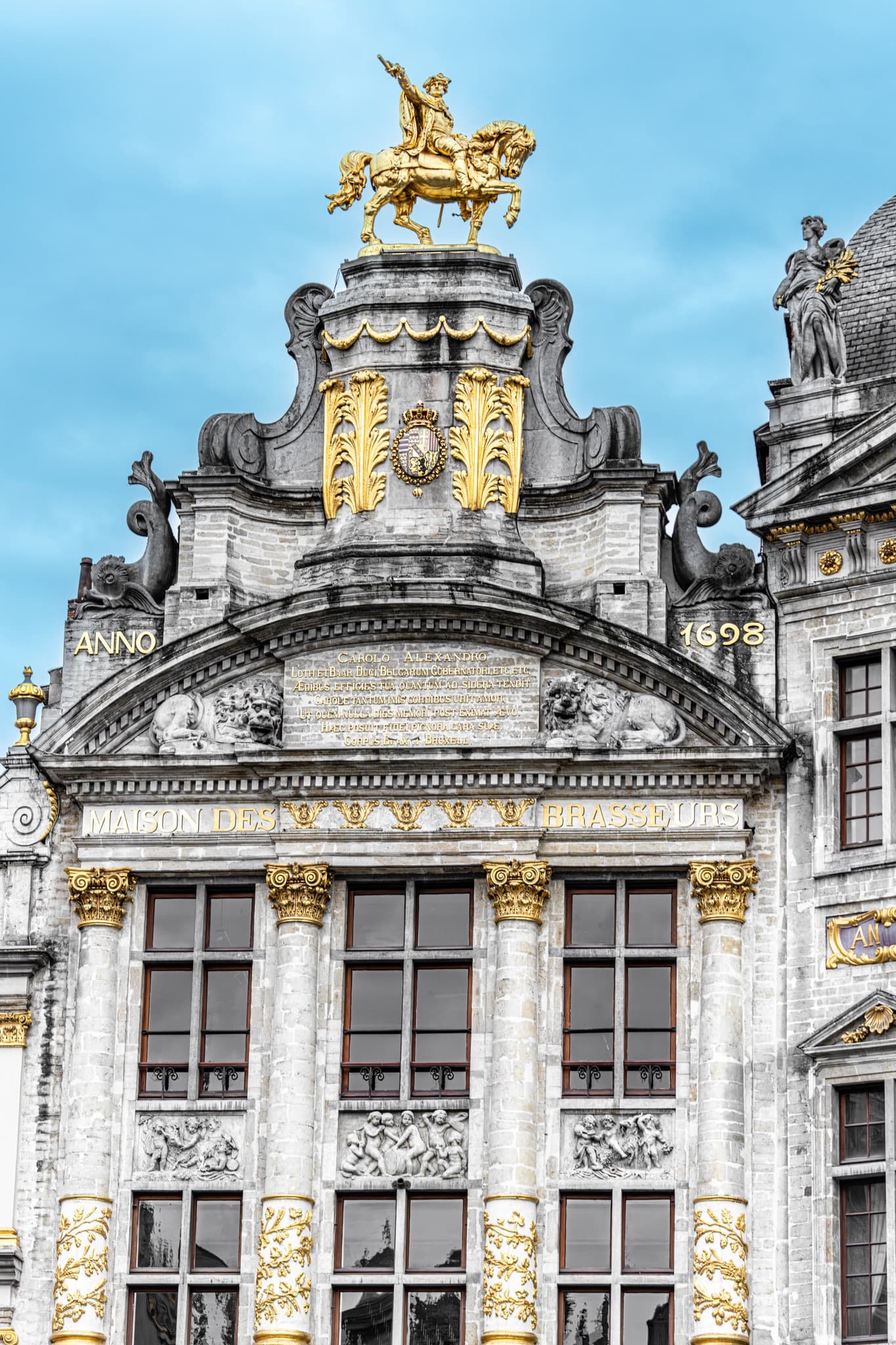 Crown Above Columns. A stone crown binding the columns to a restrained ceremonial presence.