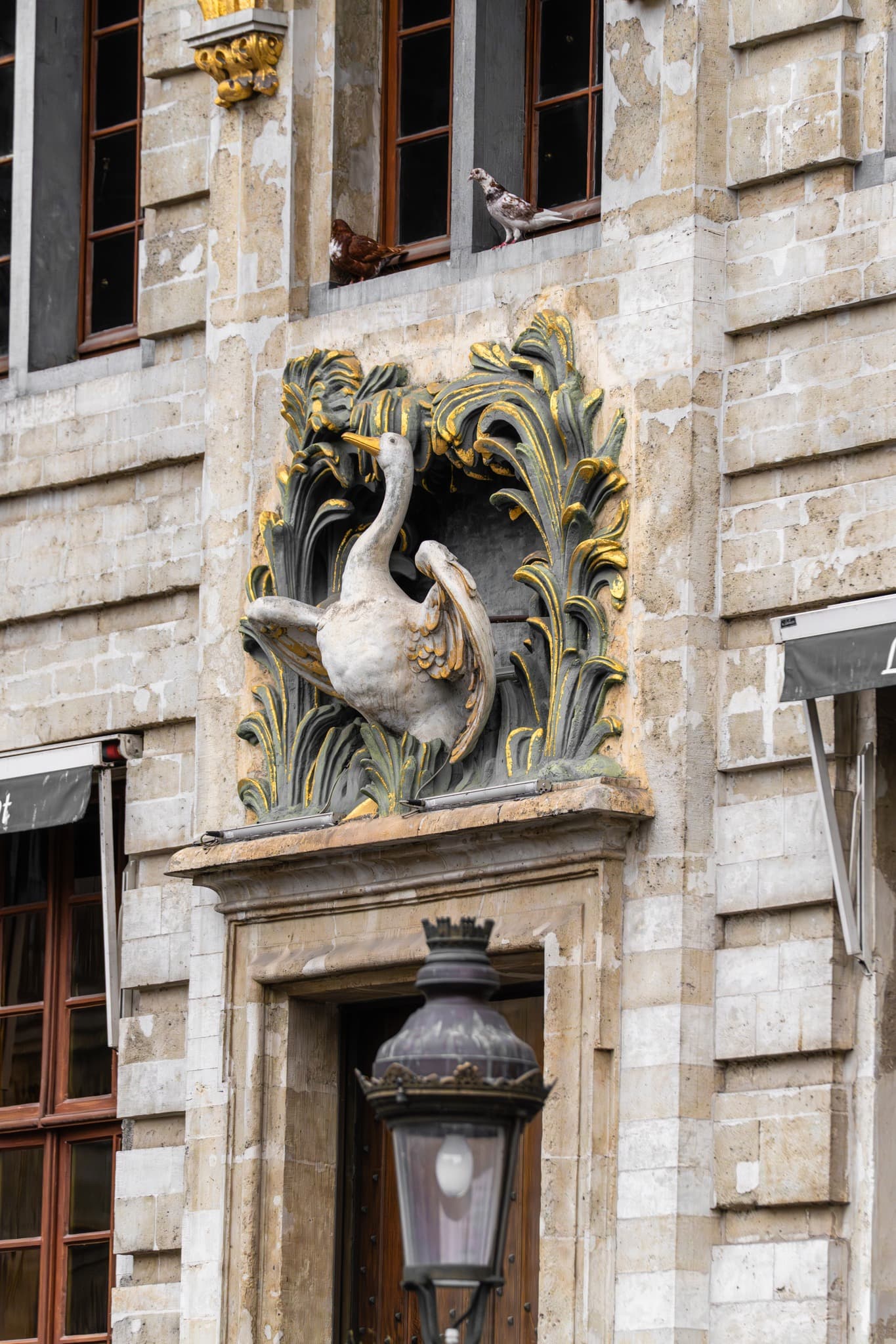 Winged Gargoyle. A carved detail carrying mythical character and vertical force.