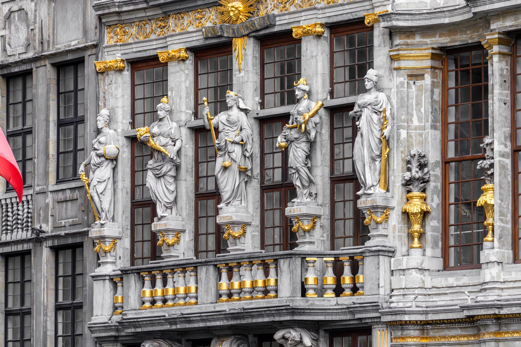 Balcony of Figures. Figures and balcony form a facade with restrained theatrical presence.