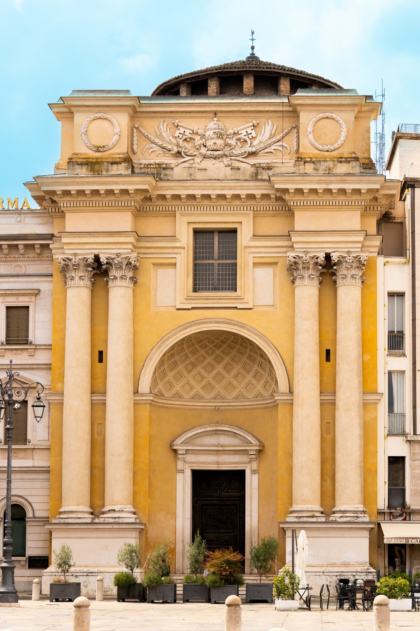 Classical Facade. Symmetry of columns and figures creates a confident, direct facade.